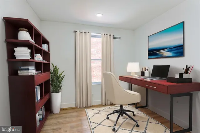 a workspace with furniture and window