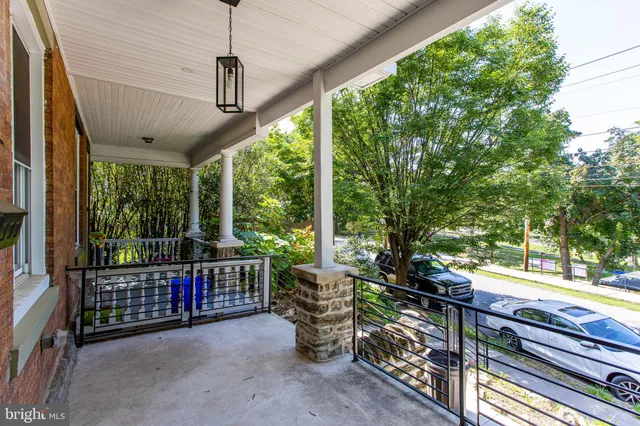 a view of a chairs and table in the balcony