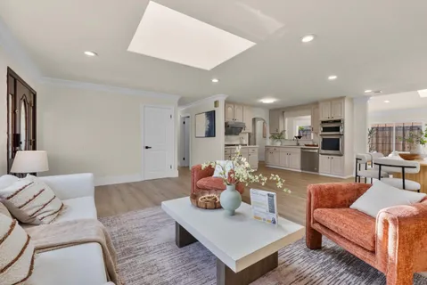 a living room with furniture and a table