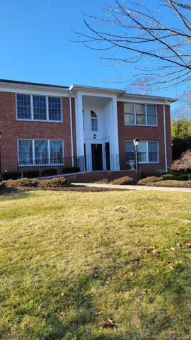 a view of a house with pool and yard
