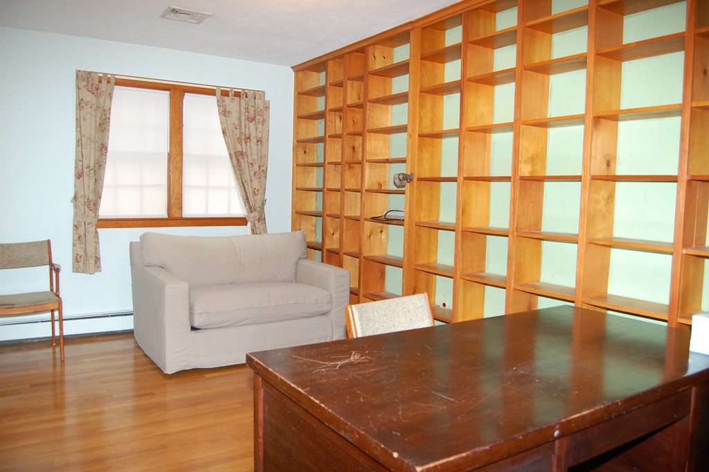 77 Old Post Road Walpole, MA 02032 - Photo 11 of 21 a living room with a large window and furniture
