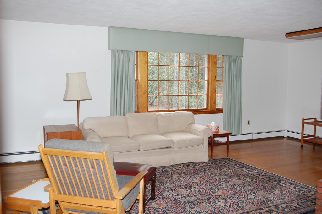 77 Old Post Road Walpole, MA 02032 - Photo 2 of 21 a living room with furniture and a window