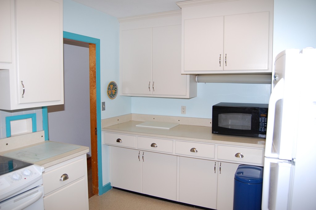 77 Old Post Road Walpole, MA 02032 - Photo 6 of 21 a kitchen with stainless steel appliances white cabinets and a sink