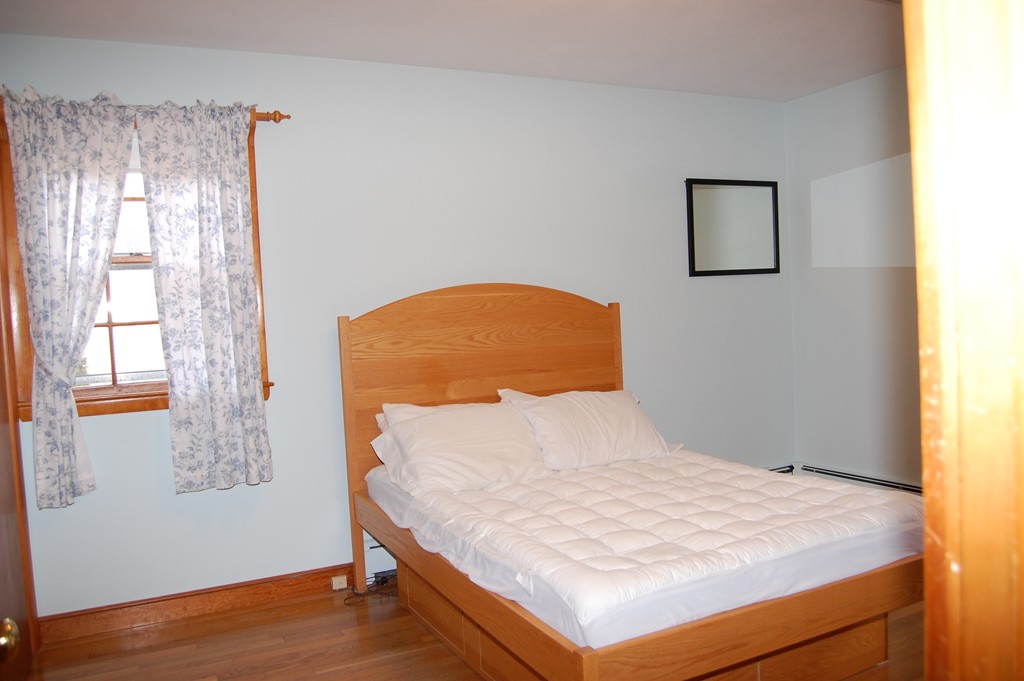 77 Old Post Road Walpole, MA 02032 - Photo 8 of 21 a bedroom with a bed and a window