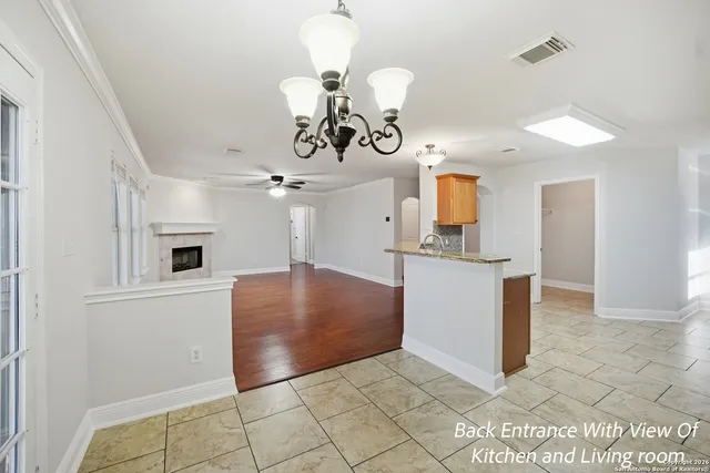 a view of a kitchen with a sink and cabinet