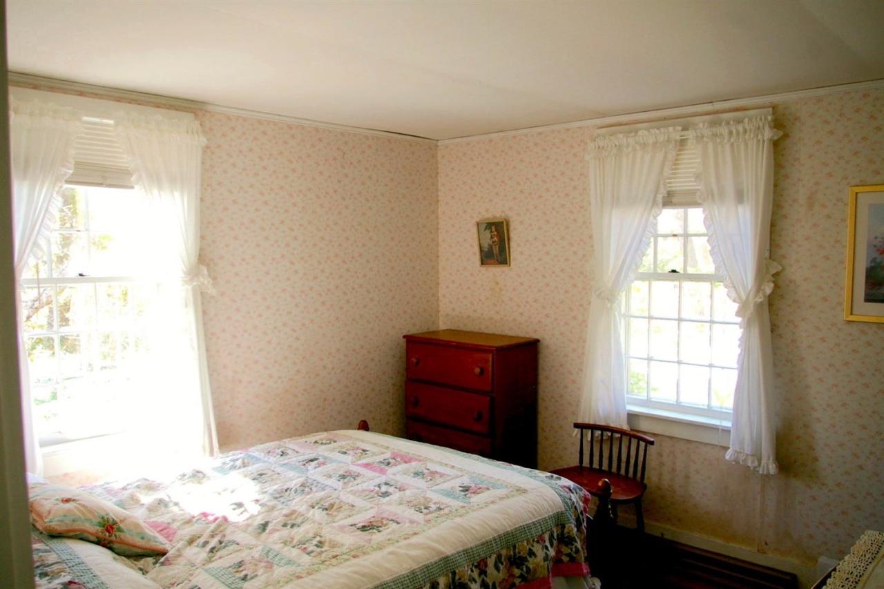 125 Mill Hill Road Wellfleet, MA 02667 - Photo 12 of 22 a bedroom with a bed and a window