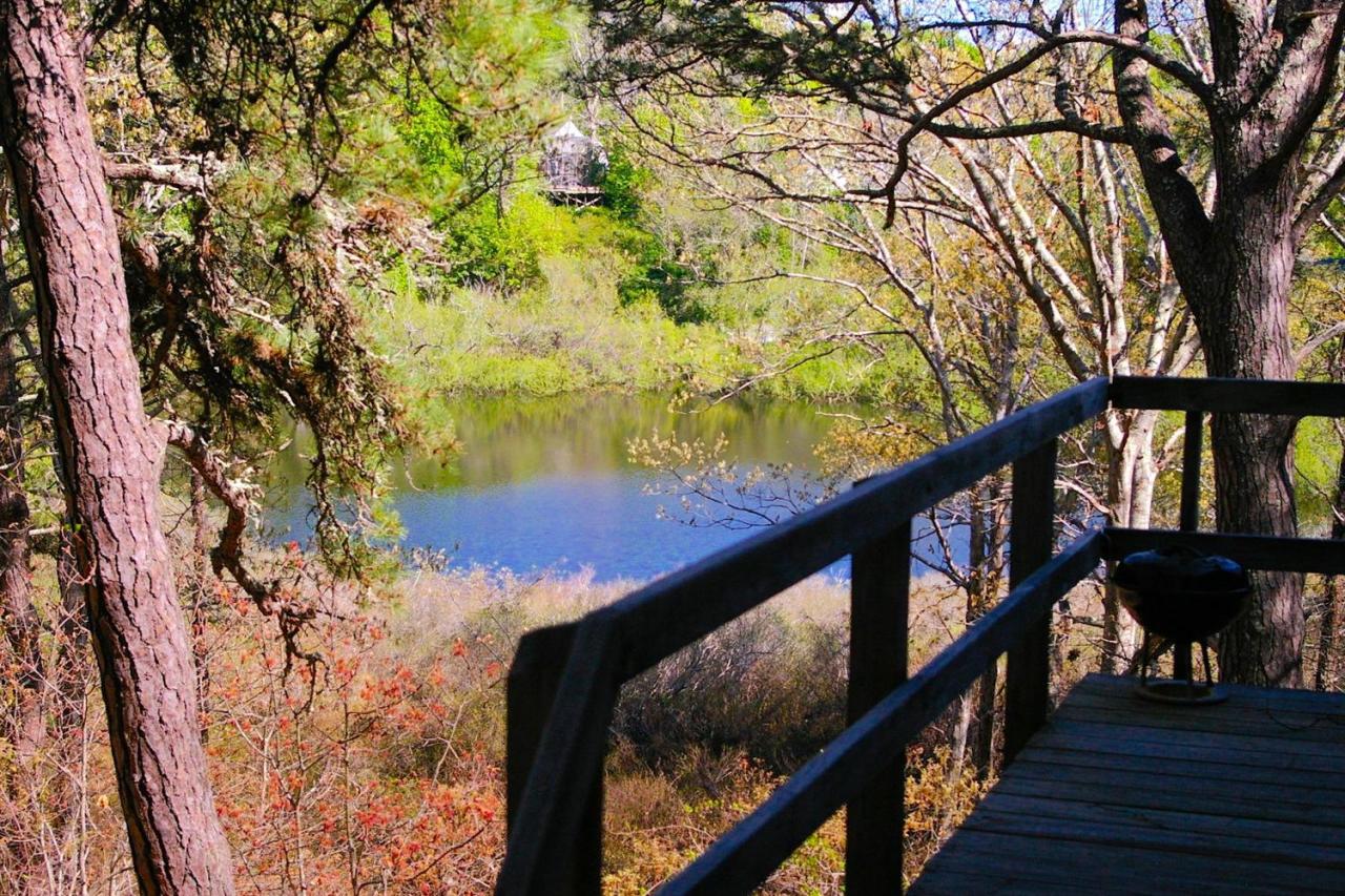 125 Mill Hill Road Wellfleet, MA 02667 - Photo 14 of 22 a view of a balcony with wooden fence and floor