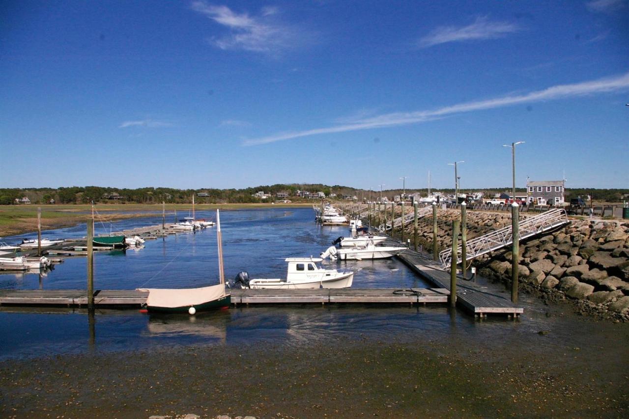125 Mill Hill Road Wellfleet, MA 02667 - Photo 20 of 22 a view of a lake with couches and city view