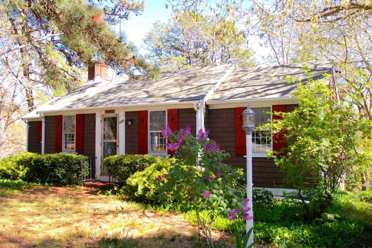 125 Mill Hill Road Wellfleet, MA 02667 - Photo 3 of 22 a front view of house with yard and trees around