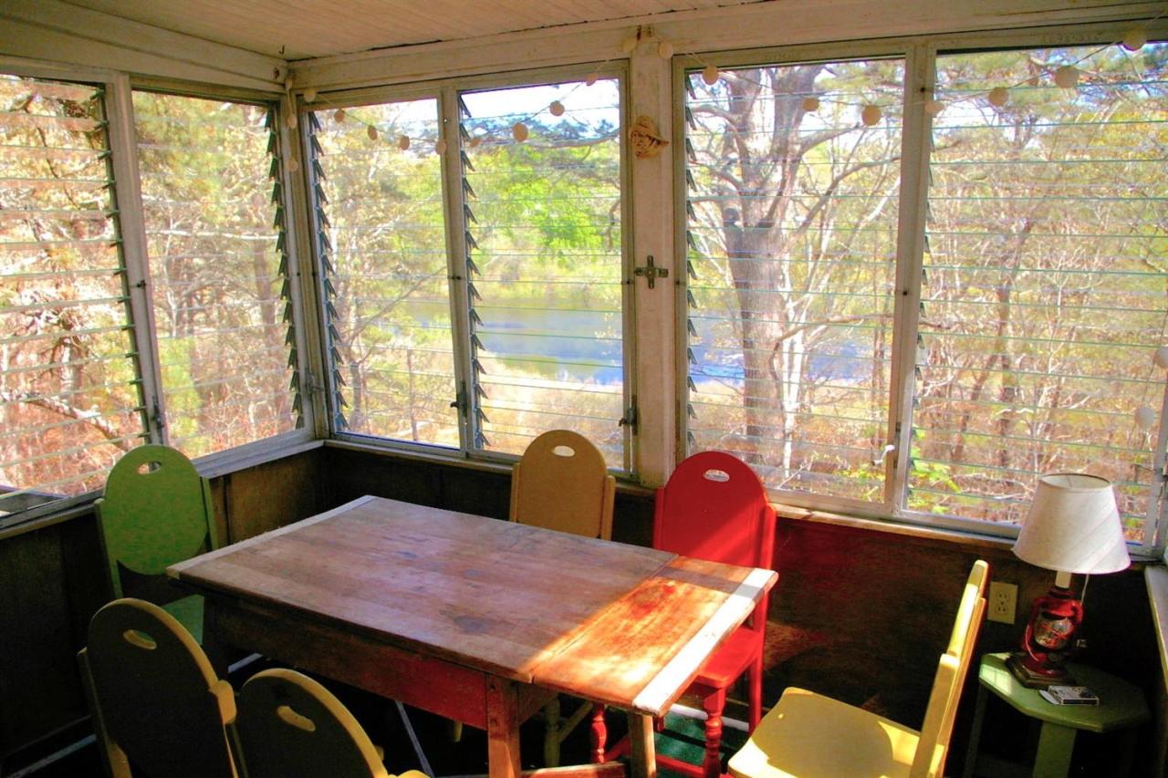 125 Mill Hill Road Wellfleet, MA 02667 - Photo 6 of 22 a view of a dining room with furniture and a window