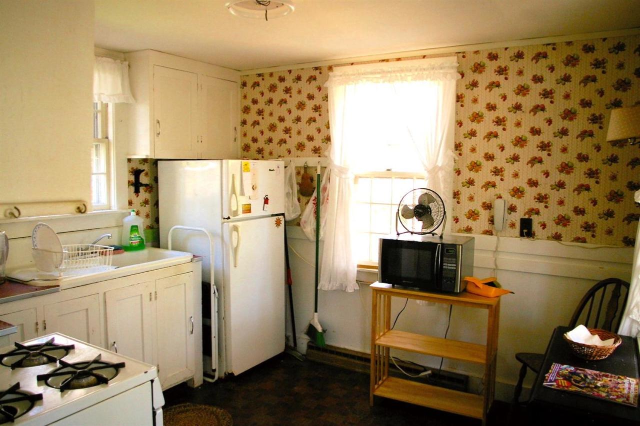 125 Mill Hill Road Wellfleet, MA 02667 - Photo 10 of 22 a kitchen with a refrigerator and a stove