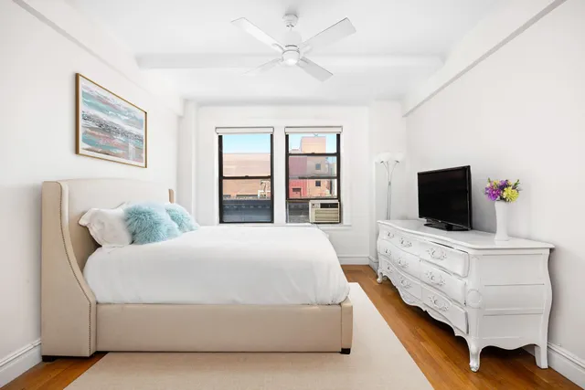 a view of a dining room with furniture and a mirror