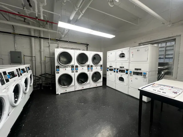 a lobby with furniture and a rug