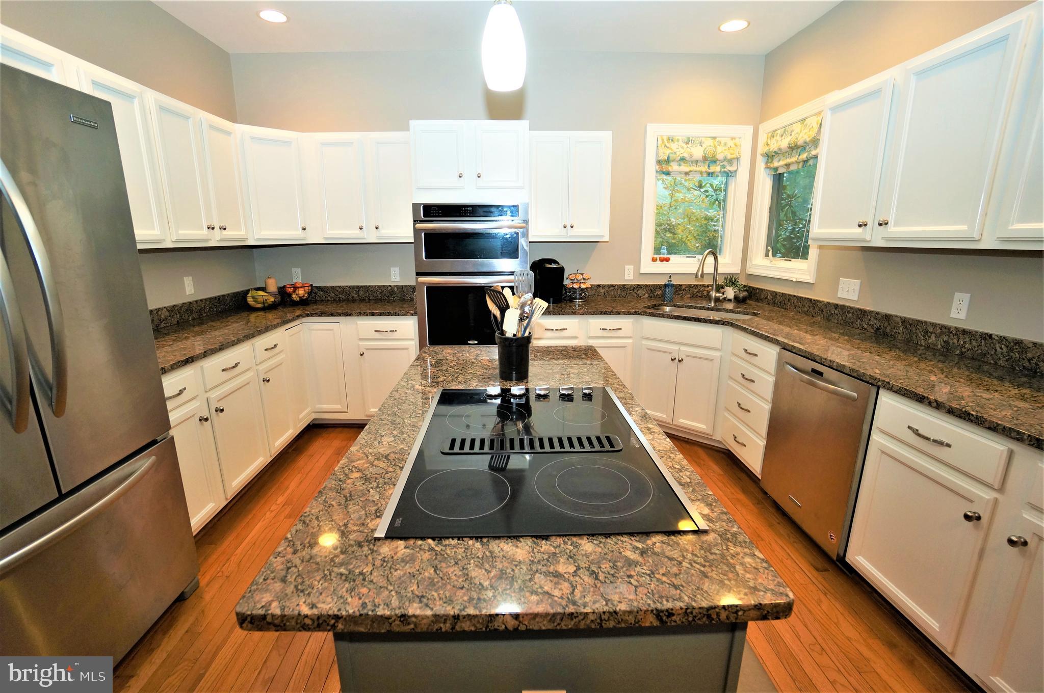 5096 Jericho Road Columbia, MD 21044 - Photo 14 of 37 Kitchen Island with JennAir Cooktop w/Downdraft
