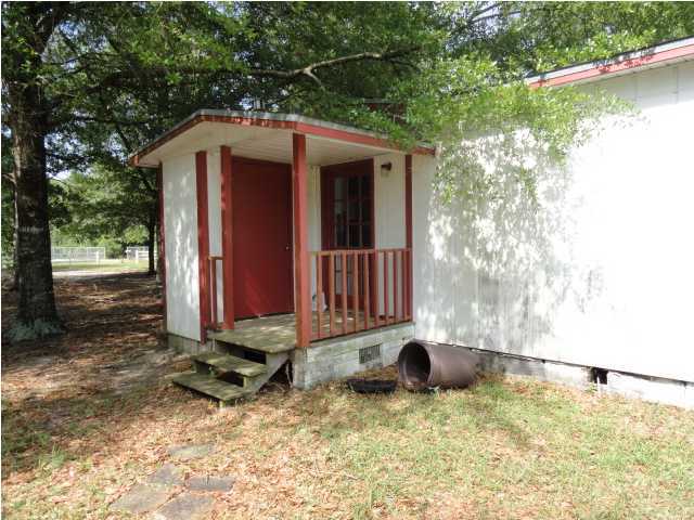 4291 Rebecca Road Crestview, FL 32539 - Photo 2 of 13 a backyard of a house with yard fire pit and outdoor seating