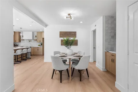 a view of kitchen with stainless steel appliances granite countertop a sink and a window
