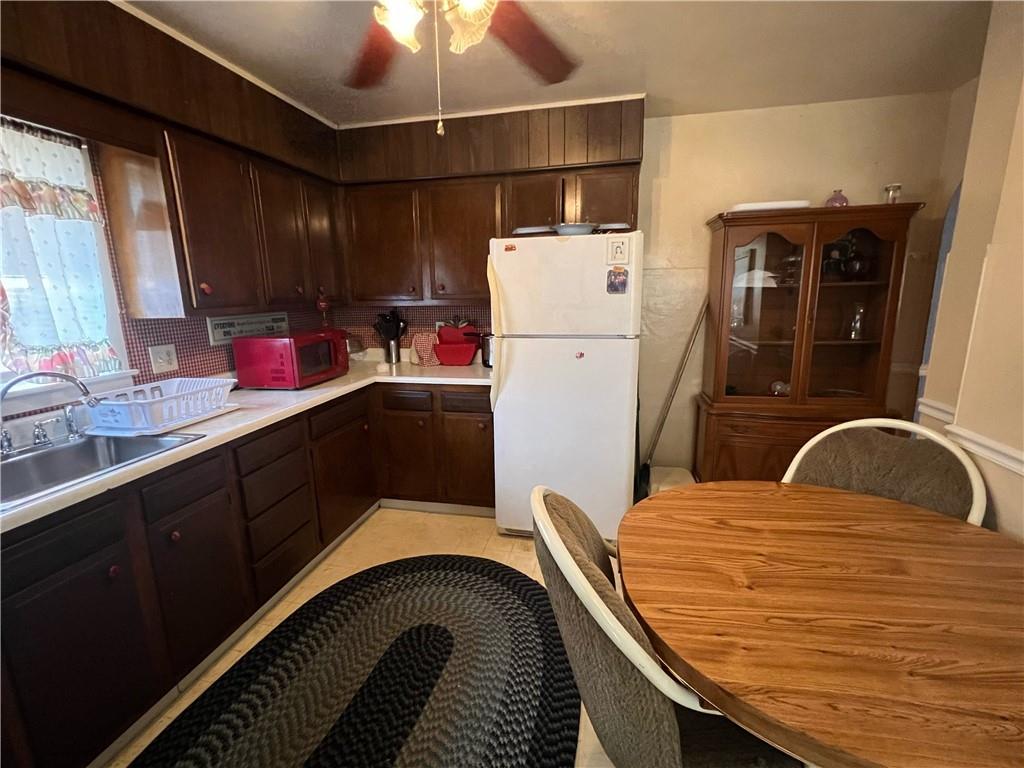 19 Fairview Street Uniontown, PA 15401 - Photo 11 of 19 a kitchen with a refrigerator and a sink
