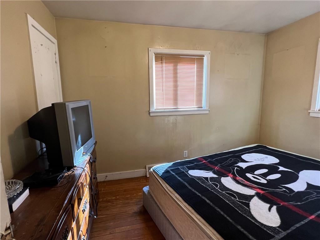 19 Fairview Street Uniontown, PA 15401 - Photo 16 of 19 a bedroom with a bed and flat screen tv