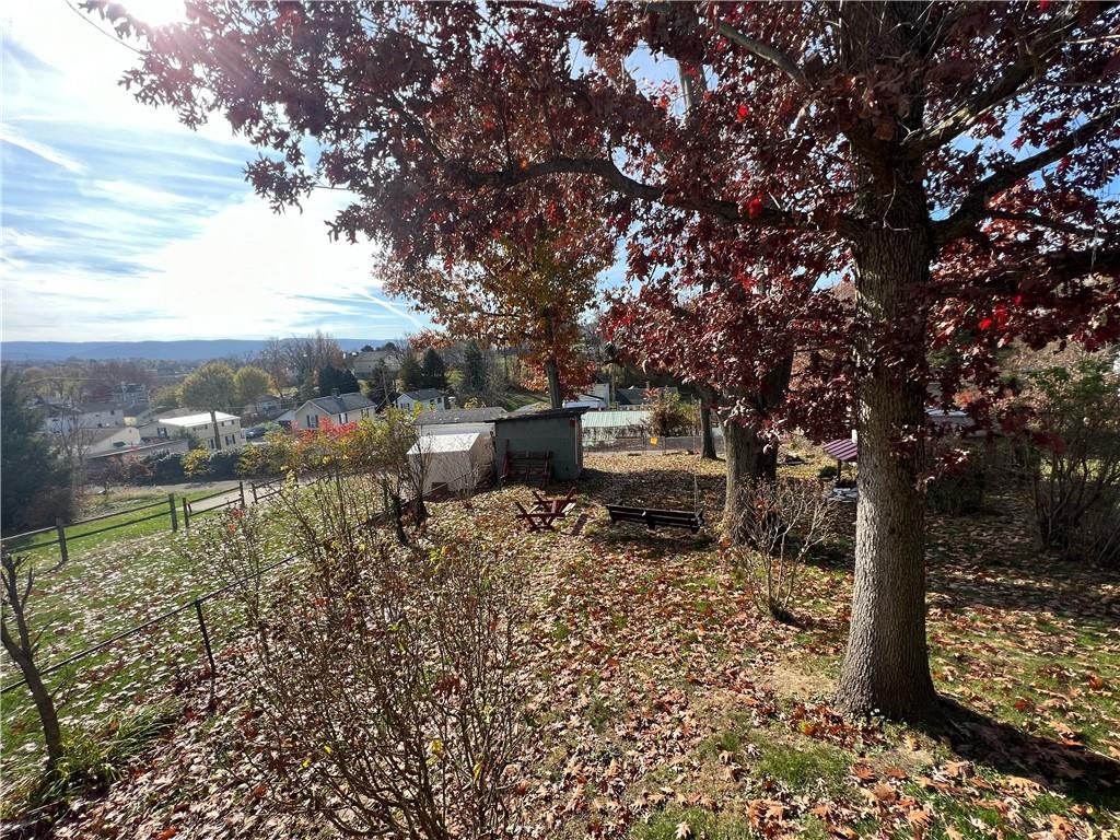 19 Fairview Street Uniontown, PA 15401 - Photo 4 of 19 a backyard of a house with table and chairs