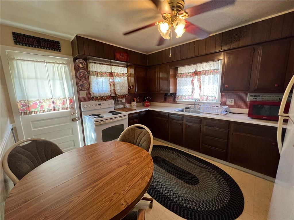 19 Fairview Street Uniontown, PA 15401 - Photo 10 of 19 a kitchen with a sink appliances and a large window