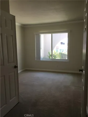 a bathroom with a toilet sink and shower curtain