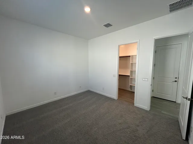 an empty room with a bathroom