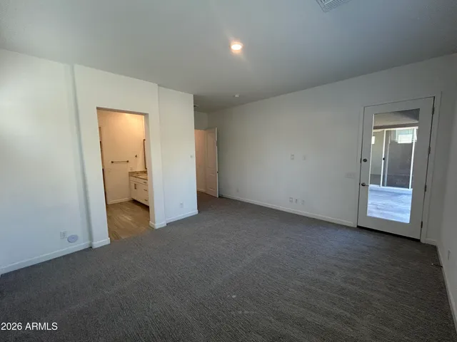 an empty room with a bathroom
