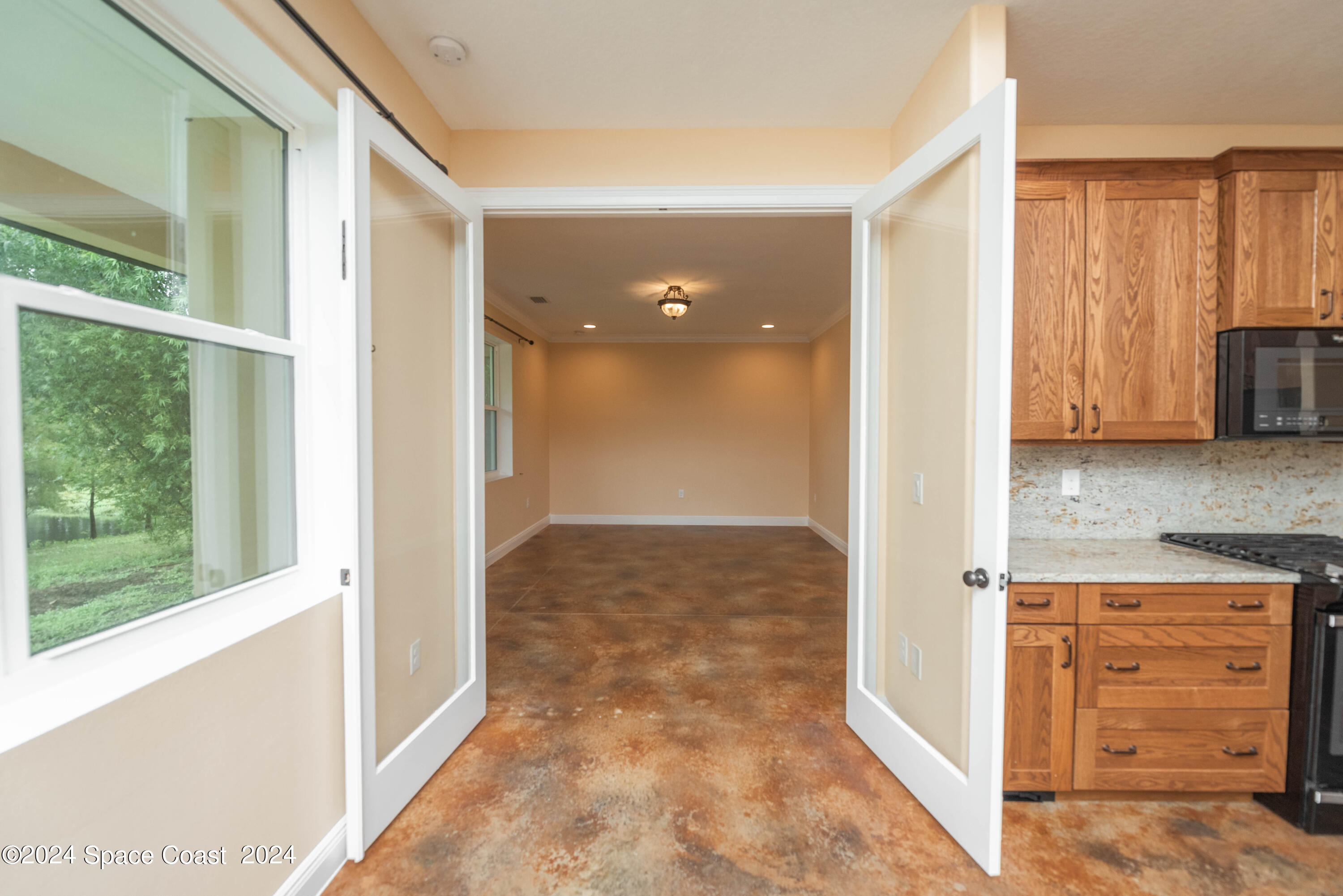 3750 Hield Road Melbourne, FL 32904 - Photo 18 of 63 a view of a kitchen with wooden floor and a sink
