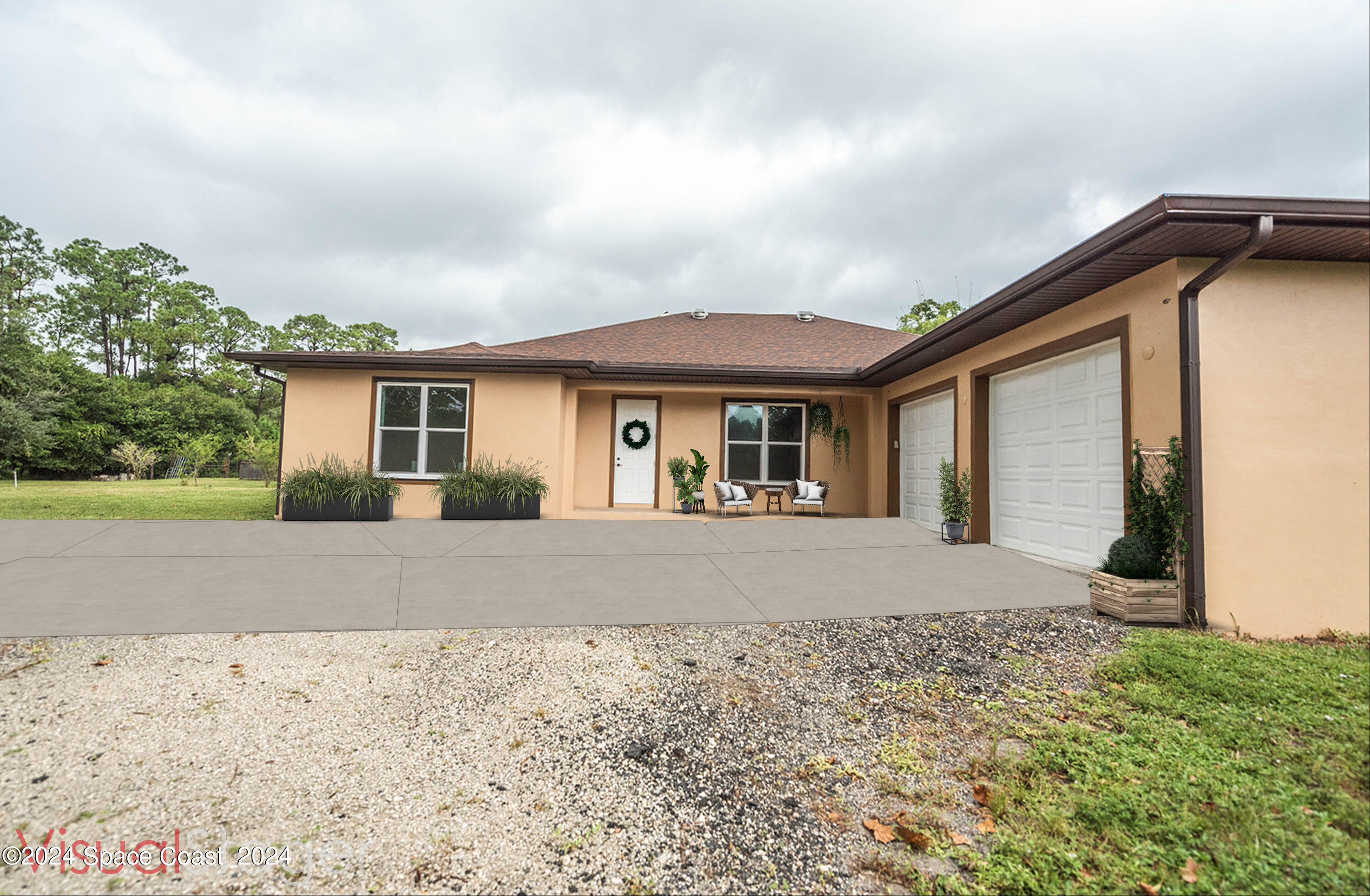 3750 Hield Road Melbourne, FL 32904 - Photo 2 of 63 a front view of a house with a yard and garage