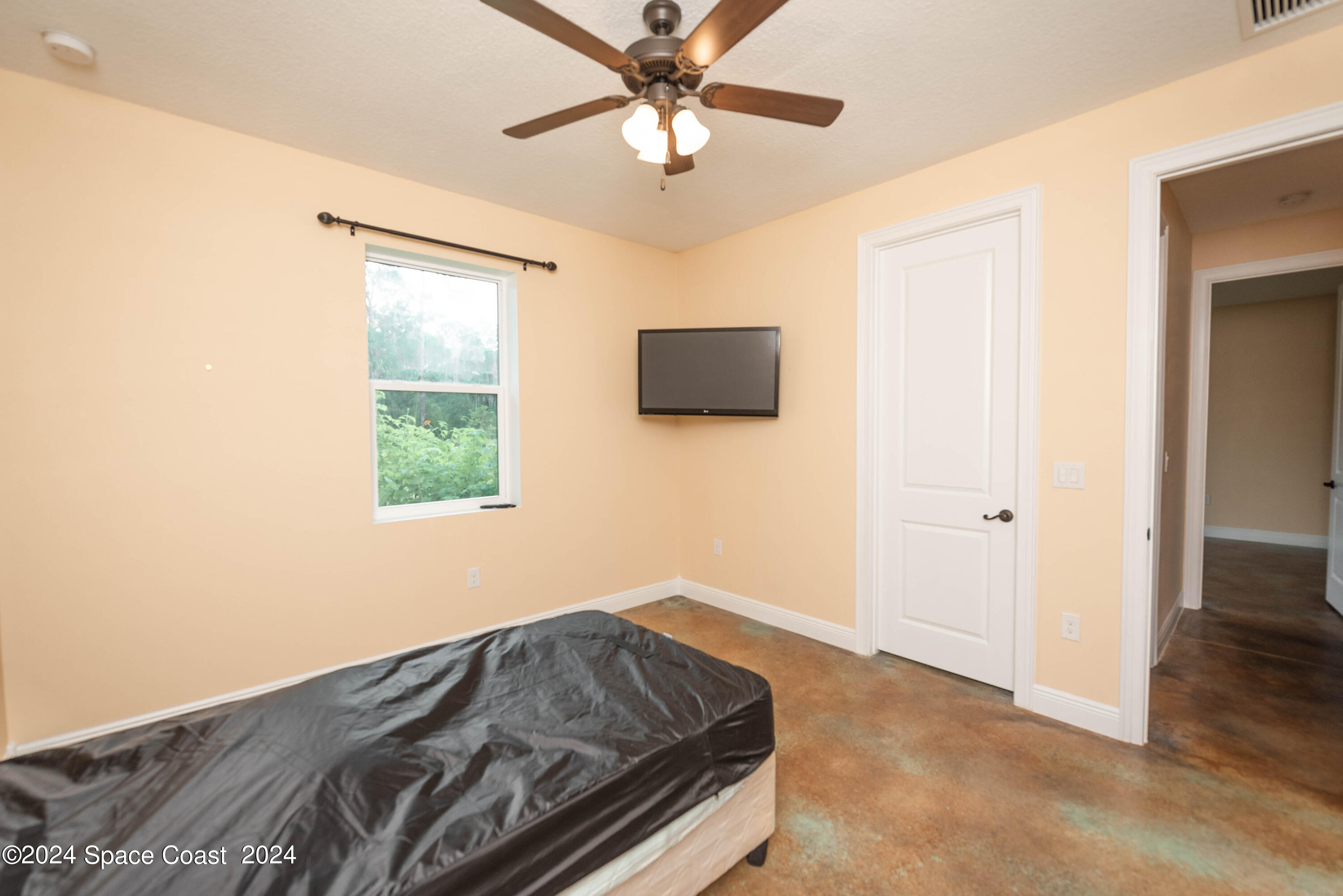 3750 Hield Road Melbourne, FL 32904 - Photo 34 of 63 a bedroom with bed and a window