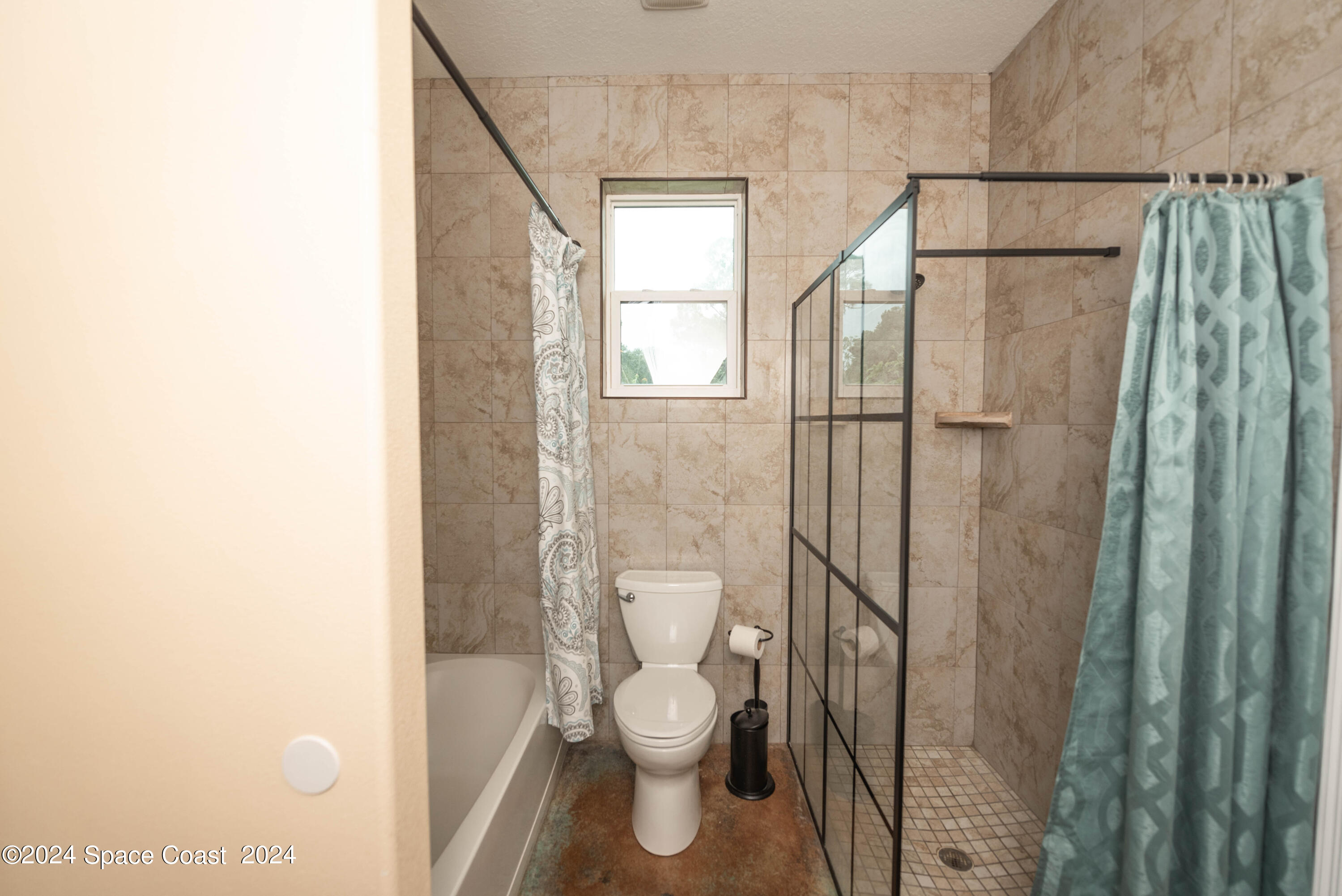3750 Hield Road Melbourne, FL 32904 - Photo 36 of 63 a bathroom with a toilet a sink and a shower
