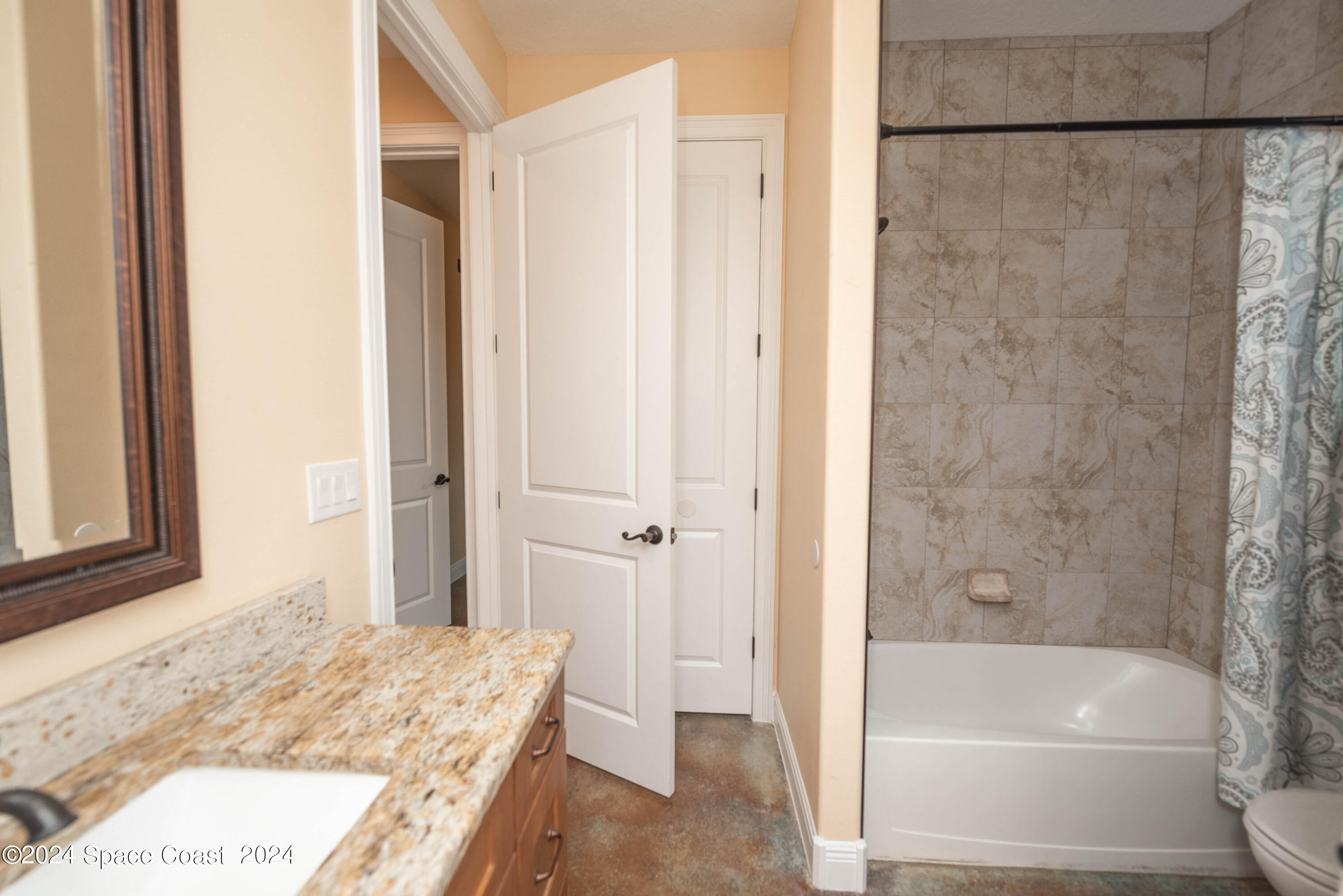 3750 Hield Road Melbourne, FL 32904 - Photo 39 of 63 a bathroom with a tub and shower