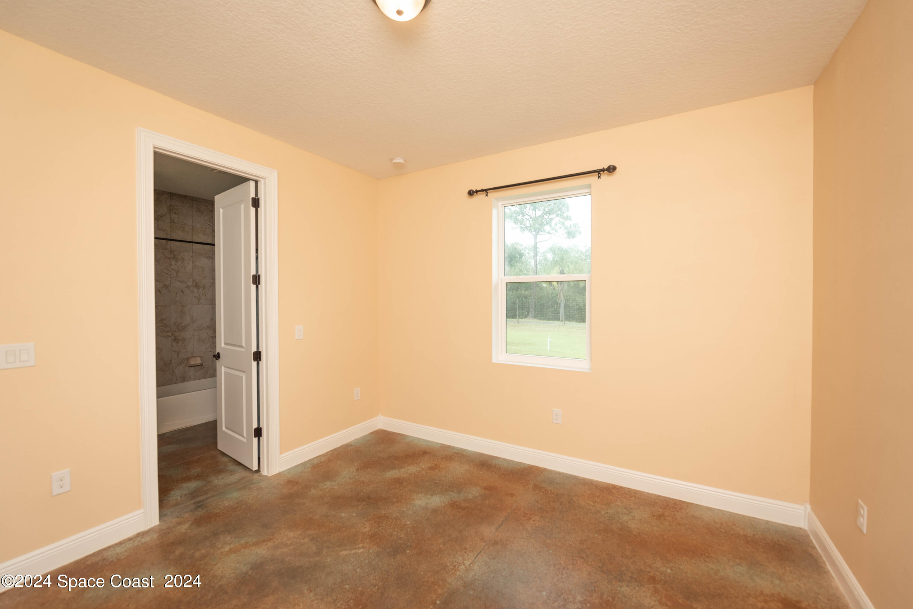 3750 Hield Road Melbourne, FL 32904 - Photo 42 of 63 a view of a room that has a window in it