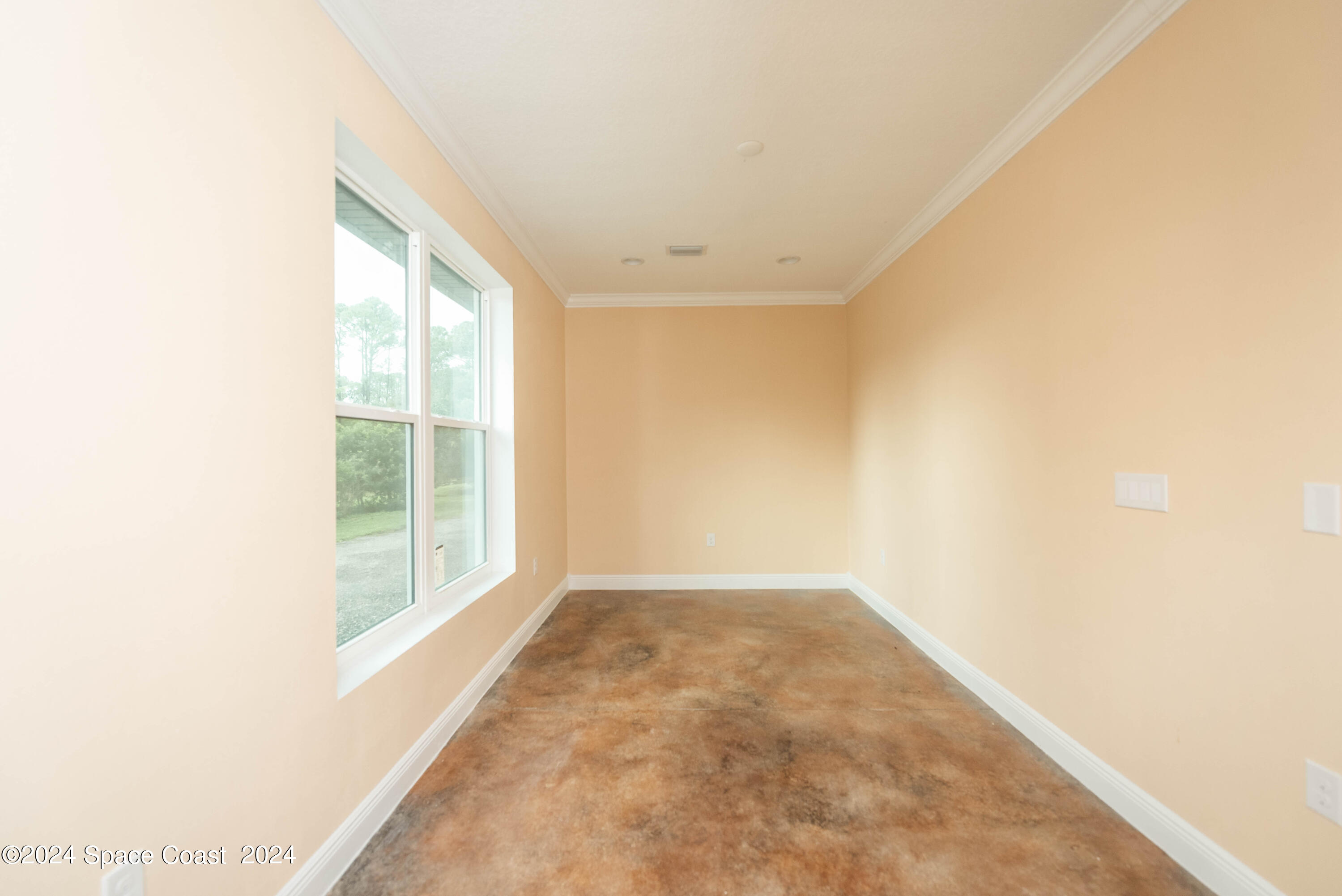 3750 Hield Road Melbourne, FL 32904 - Photo 46 of 63 an empty room with windows