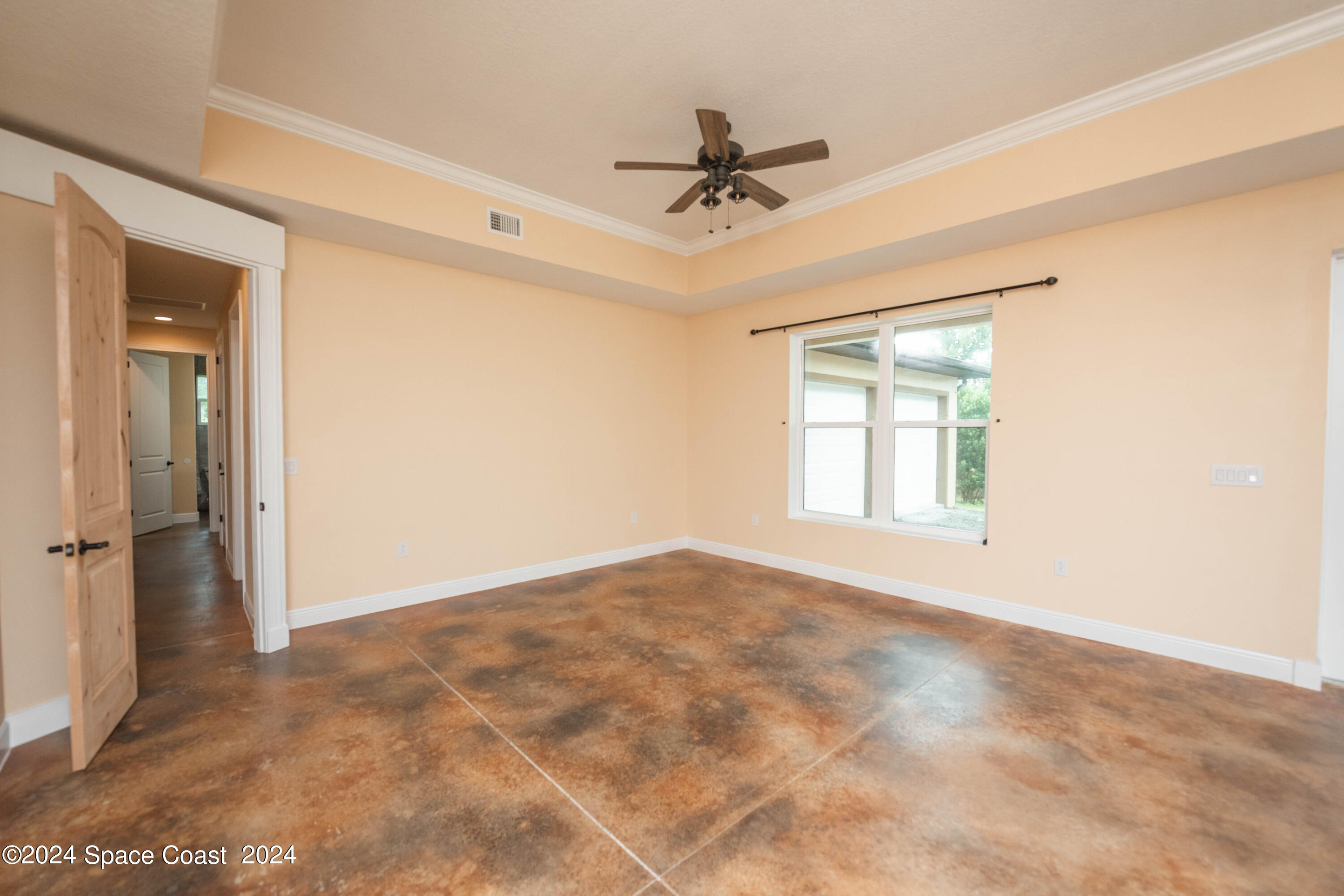 3750 Hield Road Melbourne, FL 32904 - Photo 5 of 63 a view of an empty room with a window