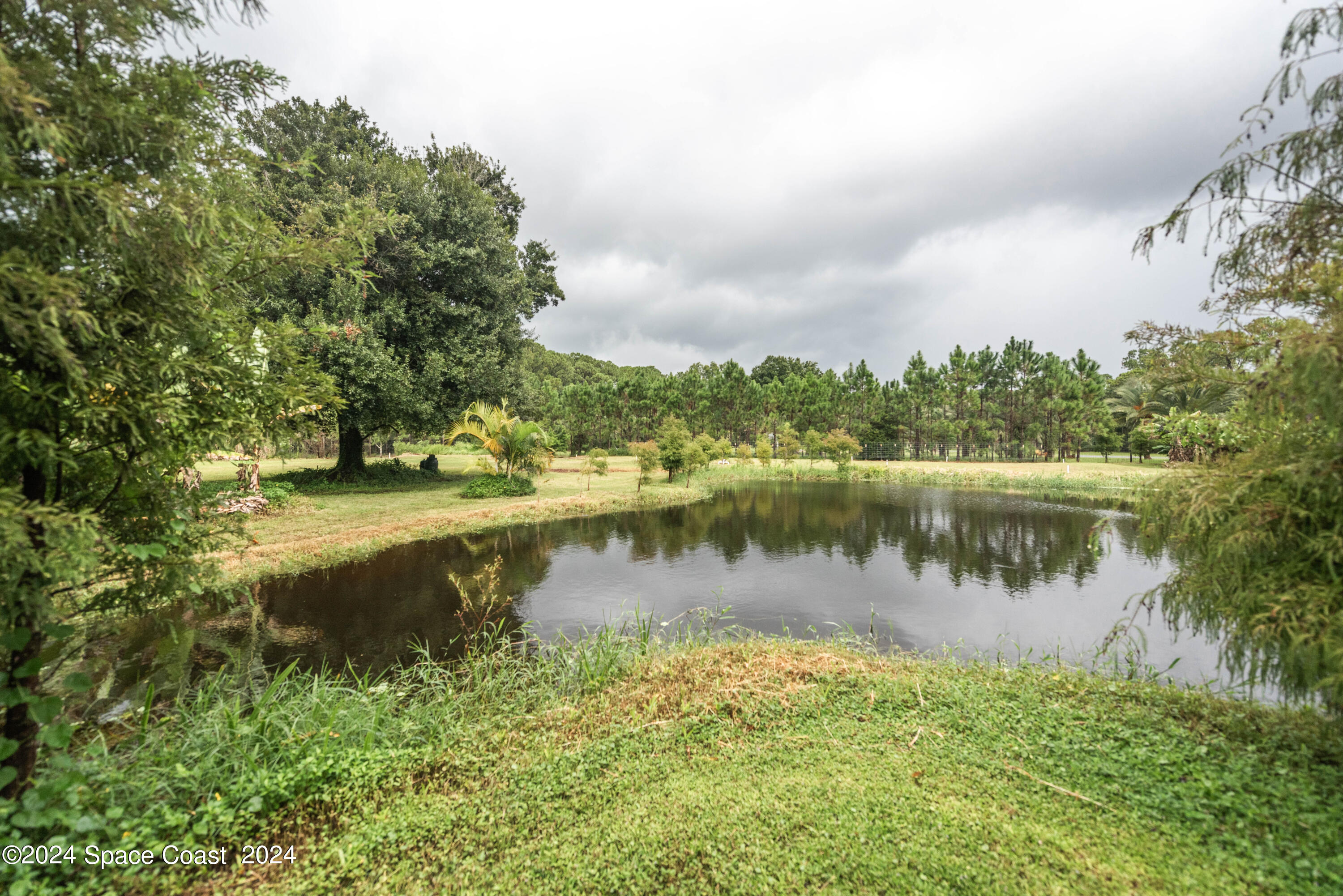 3750 Hield Road Melbourne, FL 32904 - Photo 53 of 63 a view of a lake with houses in the back