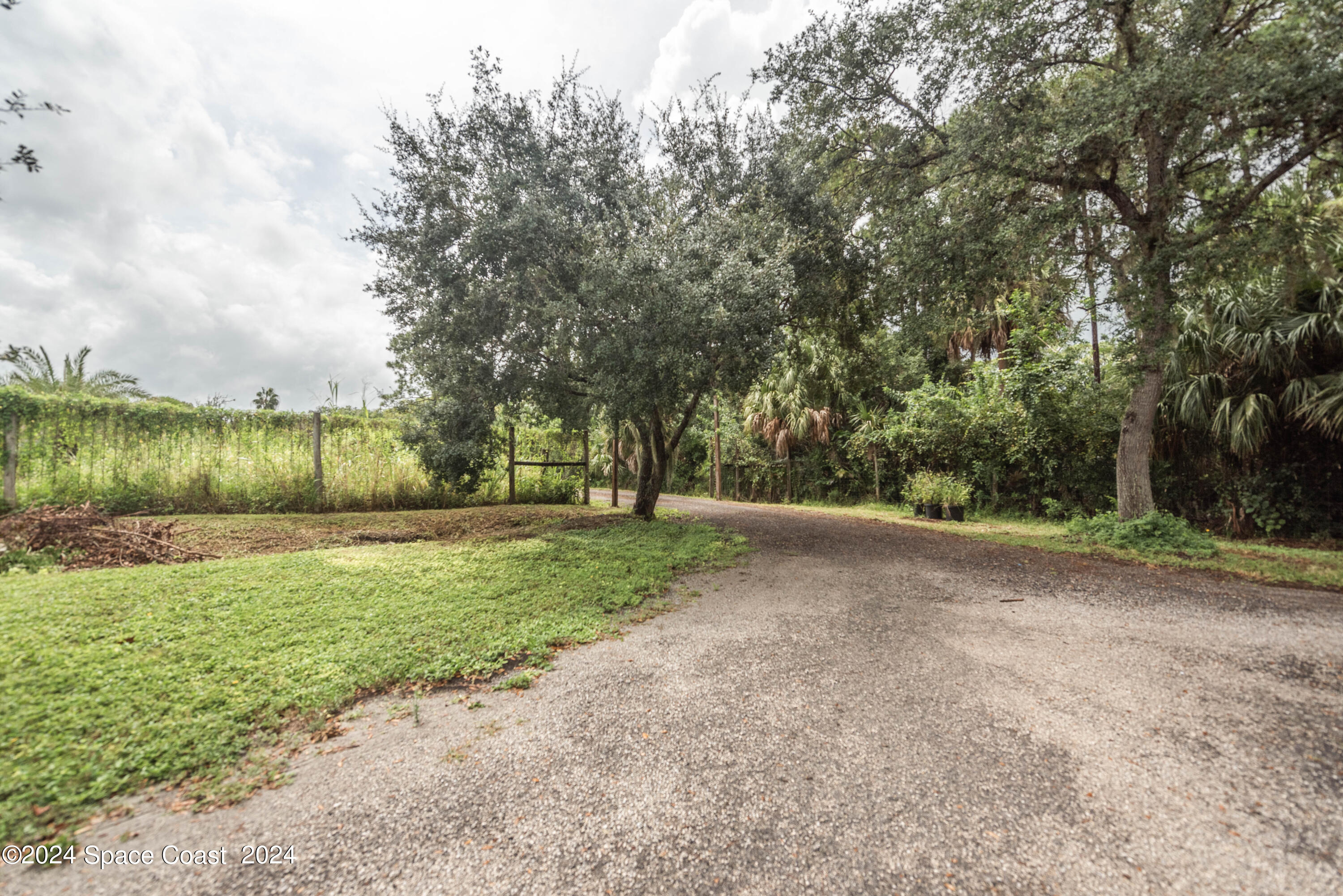 3750 Hield Road Melbourne, FL 32904 - Photo 61 of 63 a view of a street with a yard