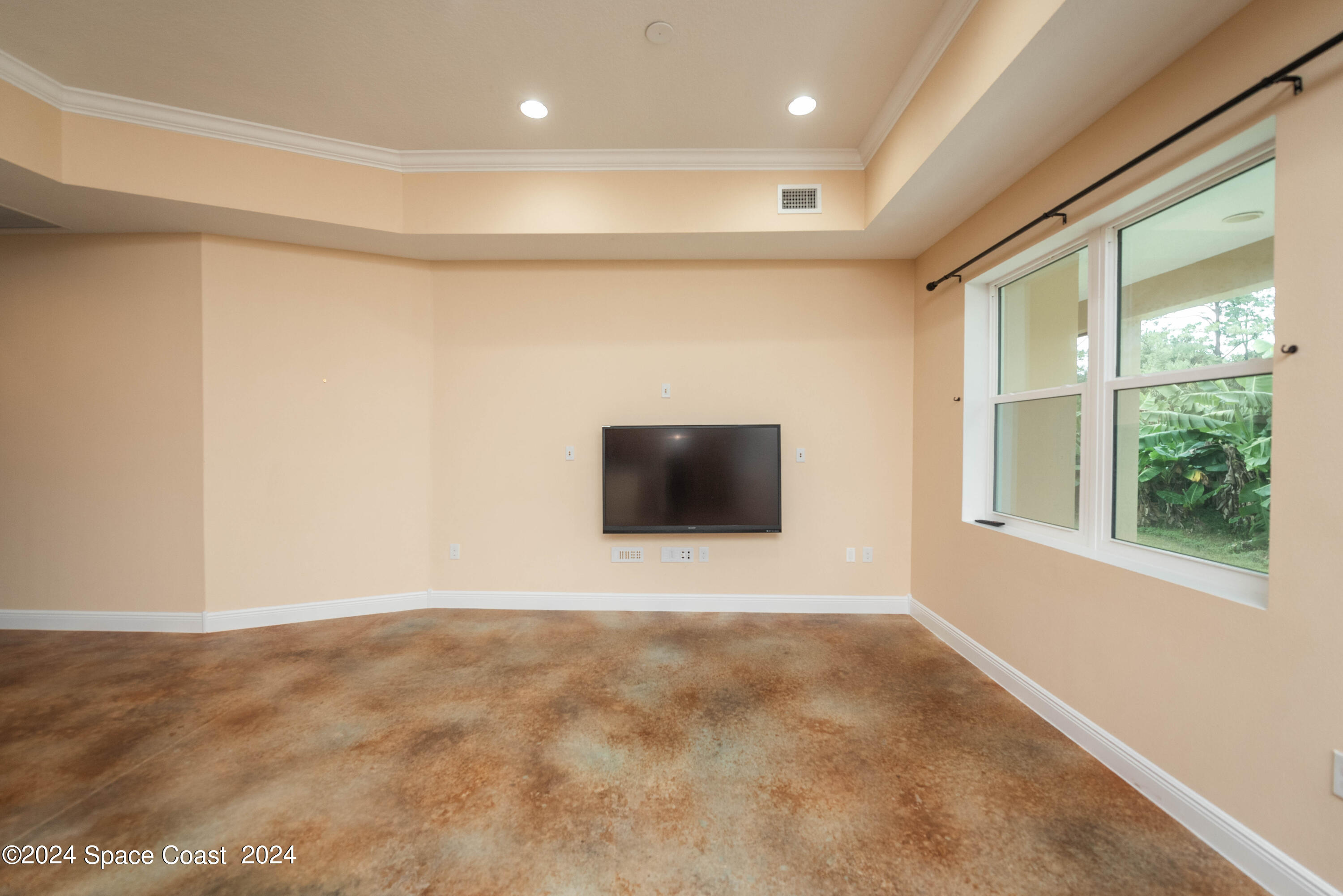3750 Hield Road Melbourne, FL 32904 - Photo 8 of 63 a view of an empty room with a window