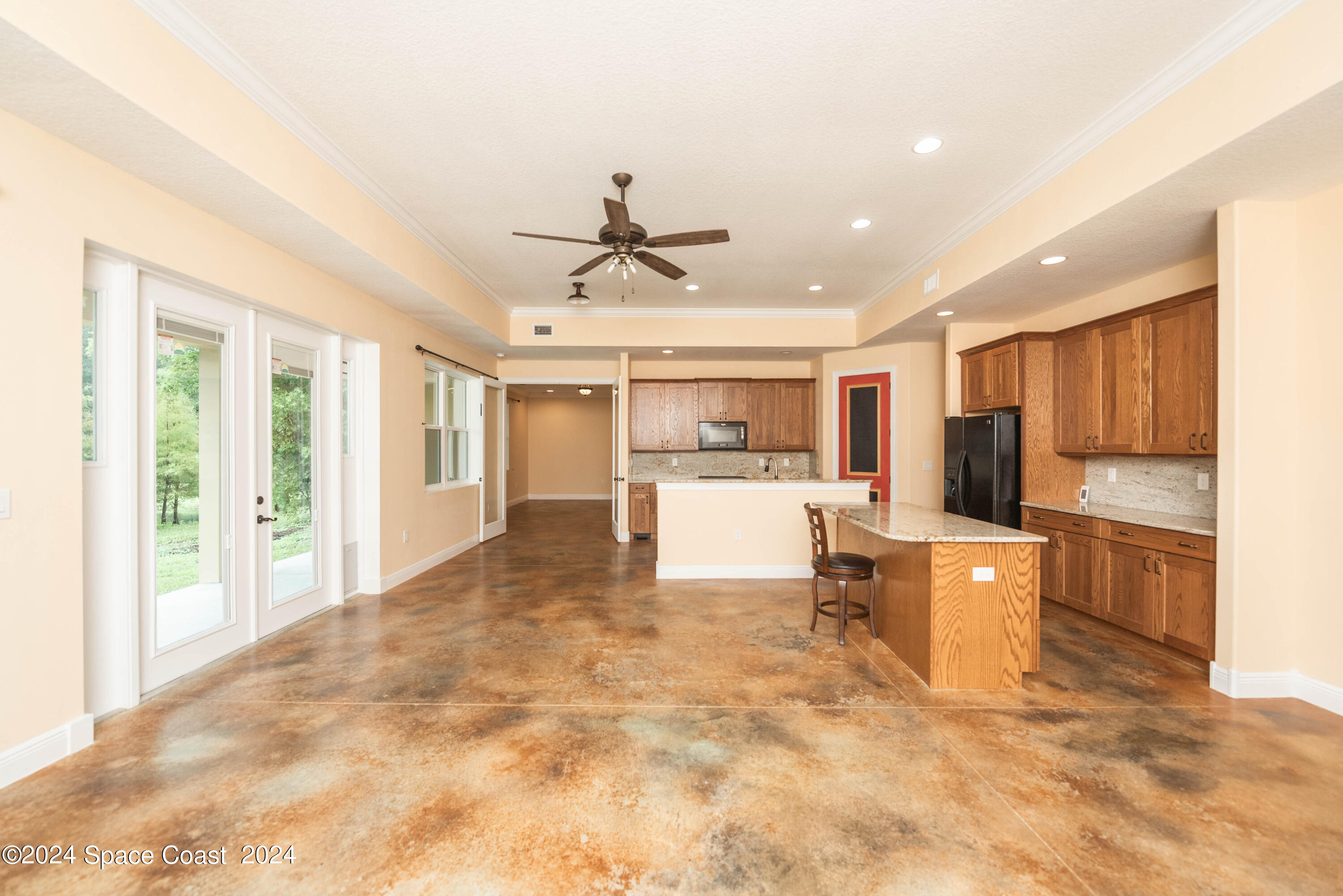 3750 Hield Road Melbourne, FL 32904 - Photo 10 of 63 a view of kitchen with furniture and refrigerator