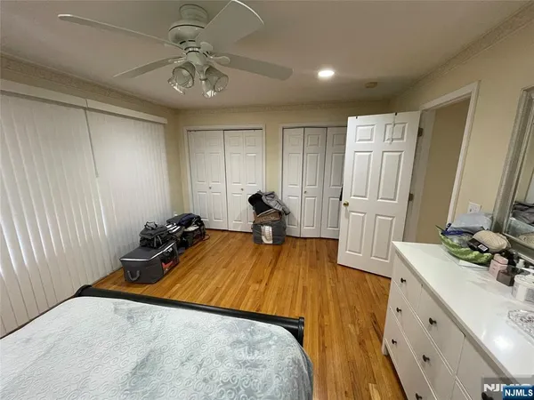 a view of a hallway and a livingroom with furniture