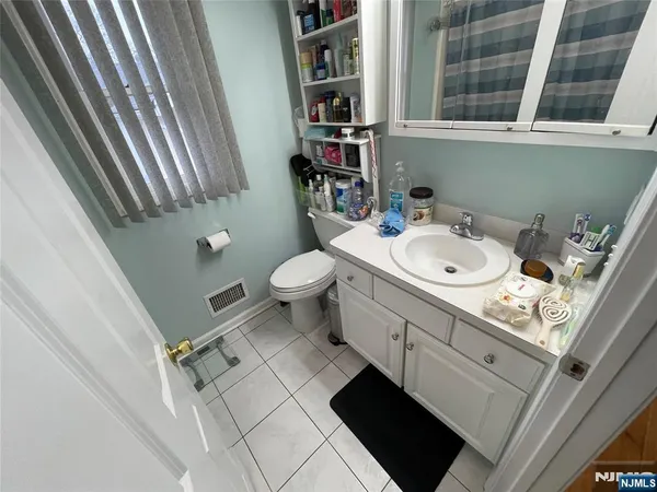 a bathroom with a shower and a bath tub