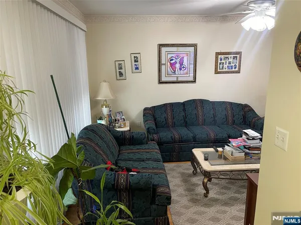 a bed room with a bed and a television