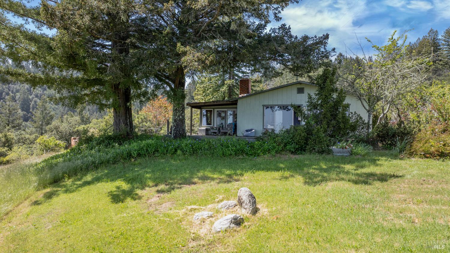 10957 Westside Road Healdsburg, CA 95448 - Photo 7 of 30 At the heart of the property is the main house, perfect for entertaining with an open layout, a generous dining area and a large deck that extends into the landscape.