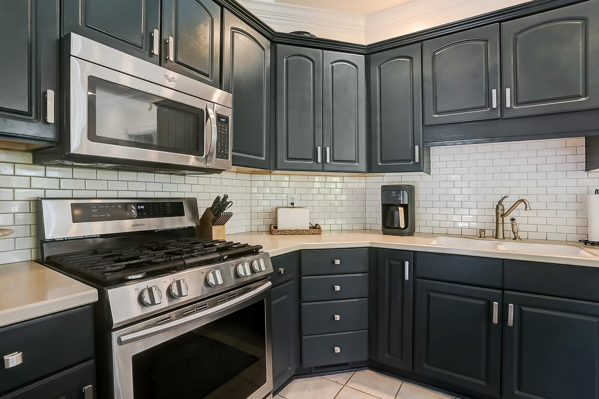 7532 King Road Fairview, TN 37062 - Photo 11 of 64 a kitchen with granite countertop a stove top oven microwave and cabinets