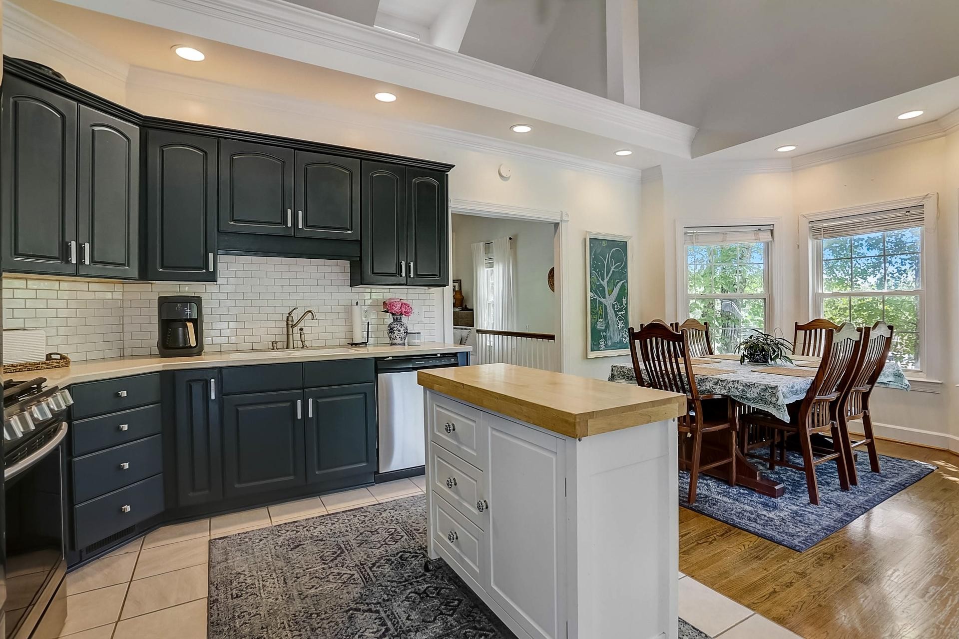 7532 King Road Fairview, TN 37062 - Photo 13 of 64 a kitchen with a stove a sink a dining table and chairs