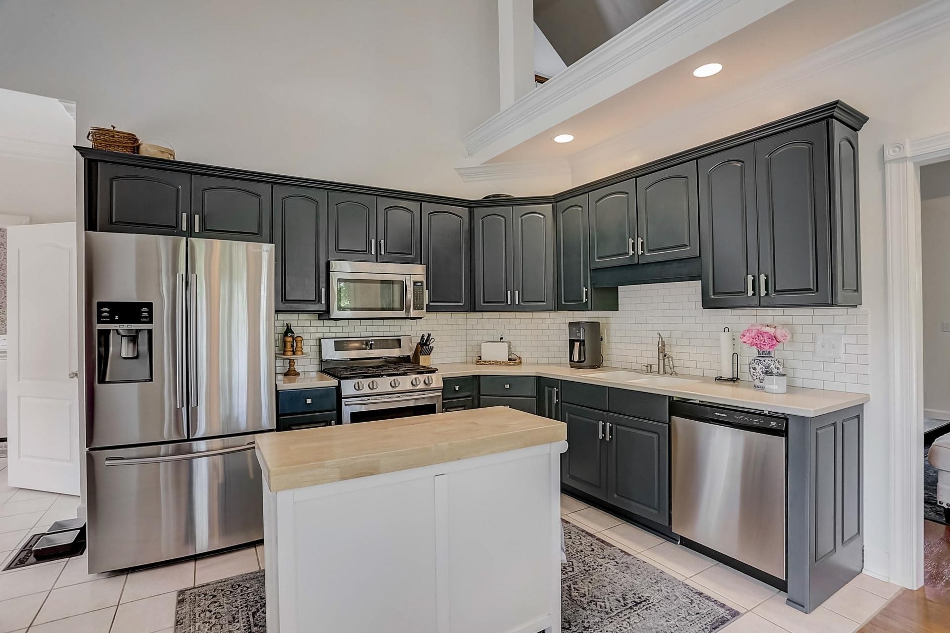 7532 King Road Fairview, TN 37062 - Photo 14 of 64 a kitchen with kitchen island a sink stainless steel appliances and cabinets