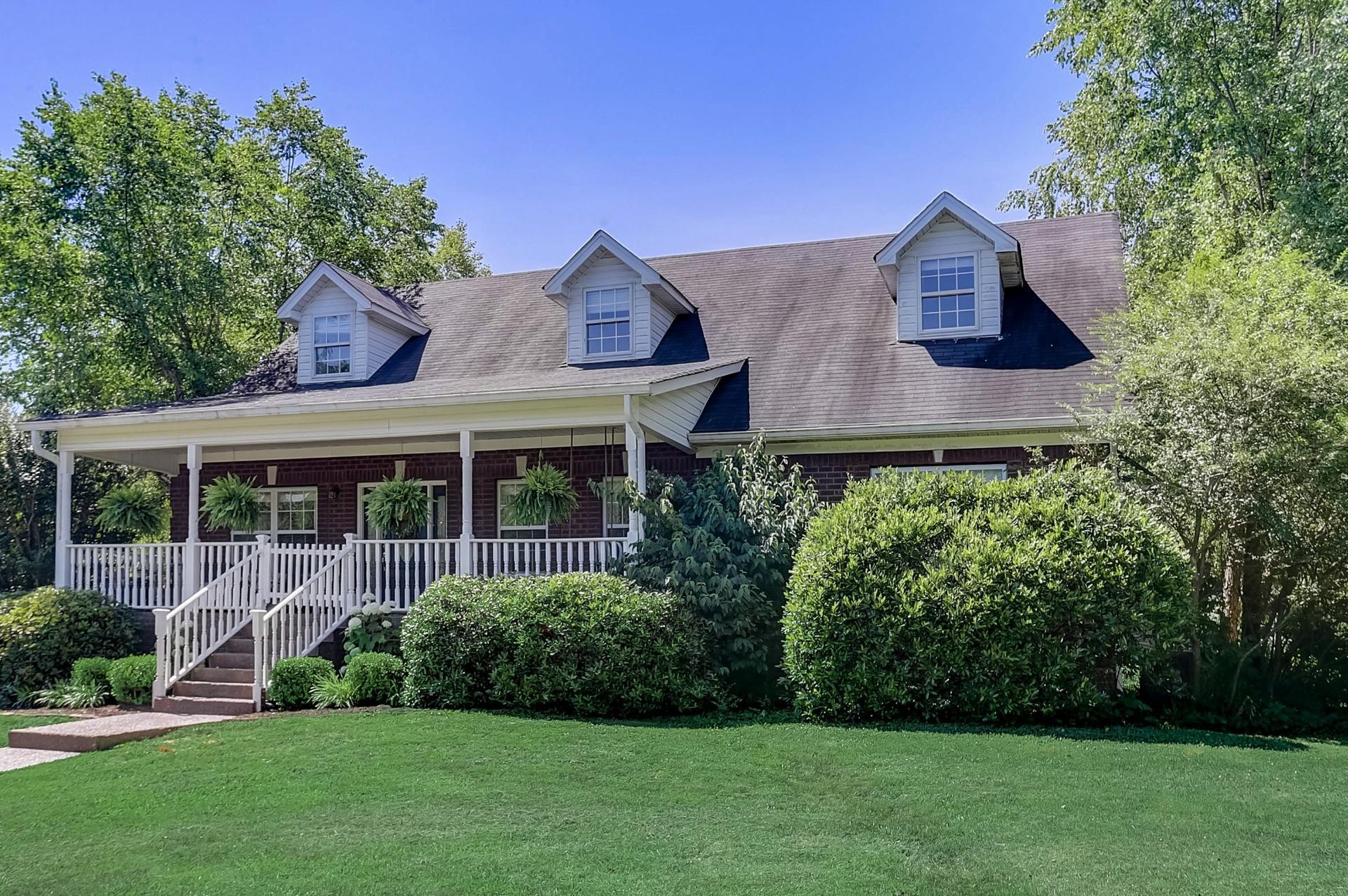 7532 King Road Fairview, TN 37062 - Photo 2 of 64 a front view of a house with a yard and trees