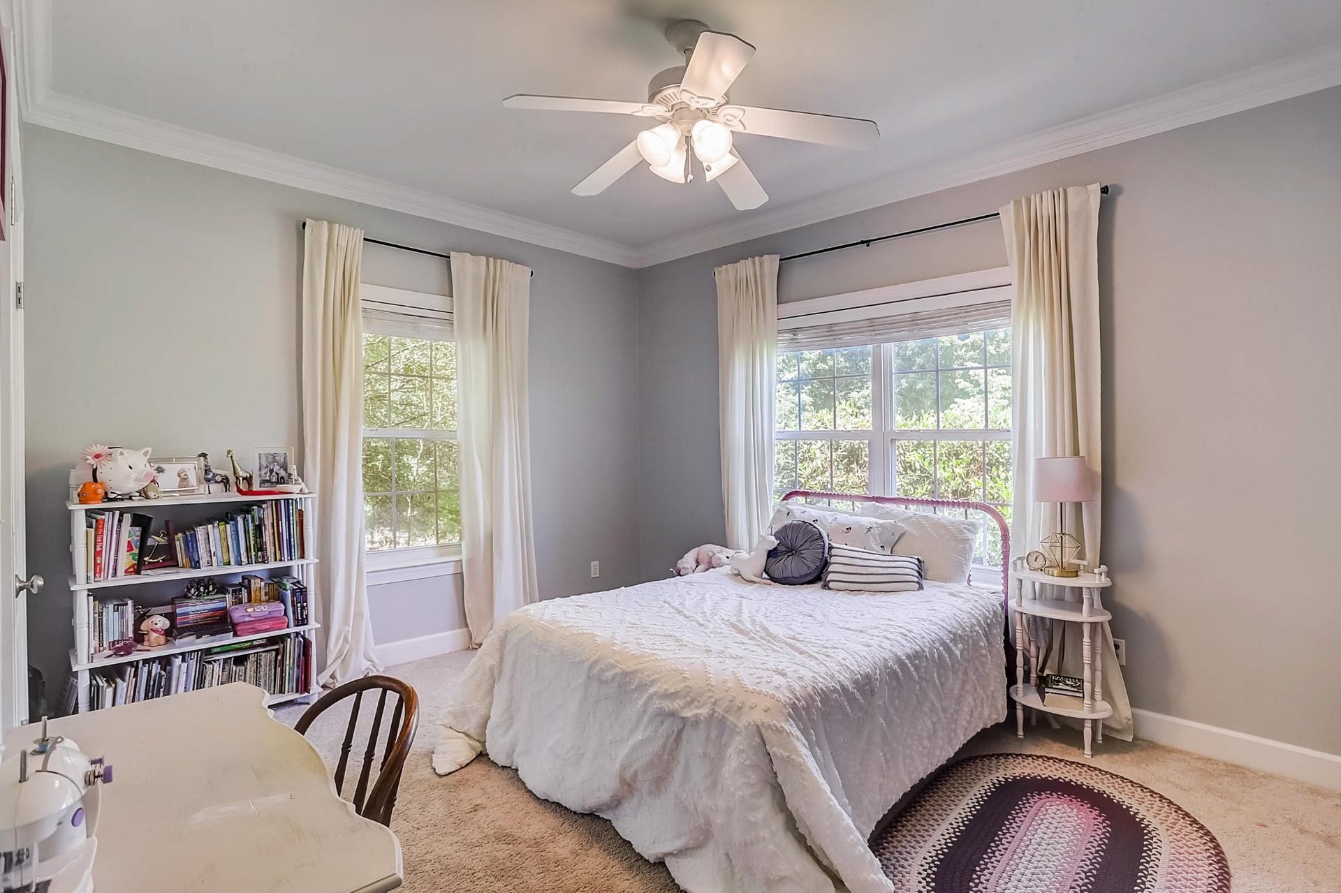 7532 King Road Fairview, TN 37062 - Photo 28 of 64 a bedroom with a bed bookshelf and a large window