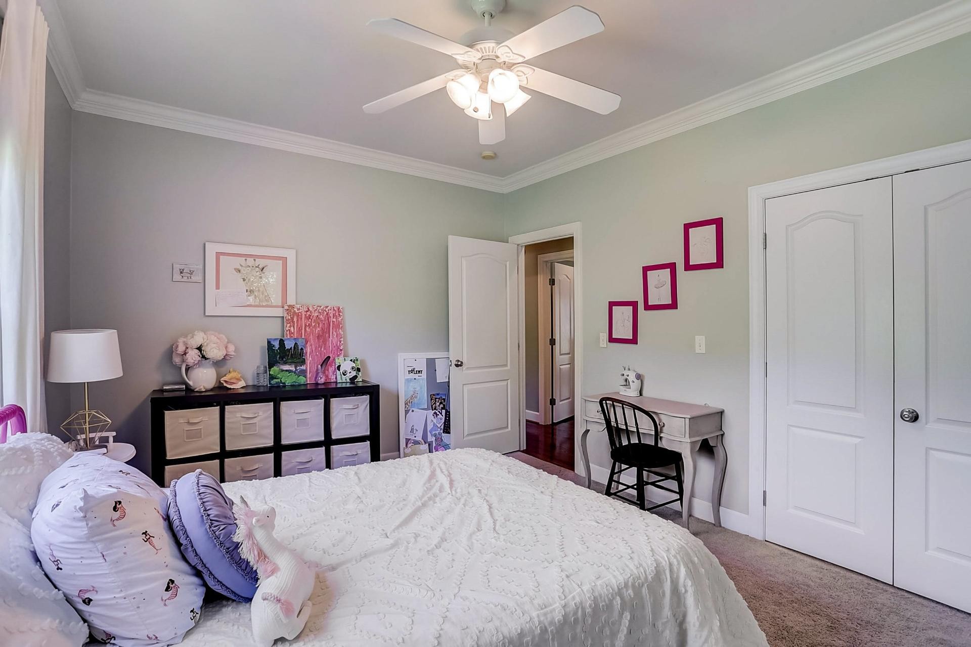 7532 King Road Fairview, TN 37062 - Photo 29 of 64 a bedroom with a bed and a chandelier