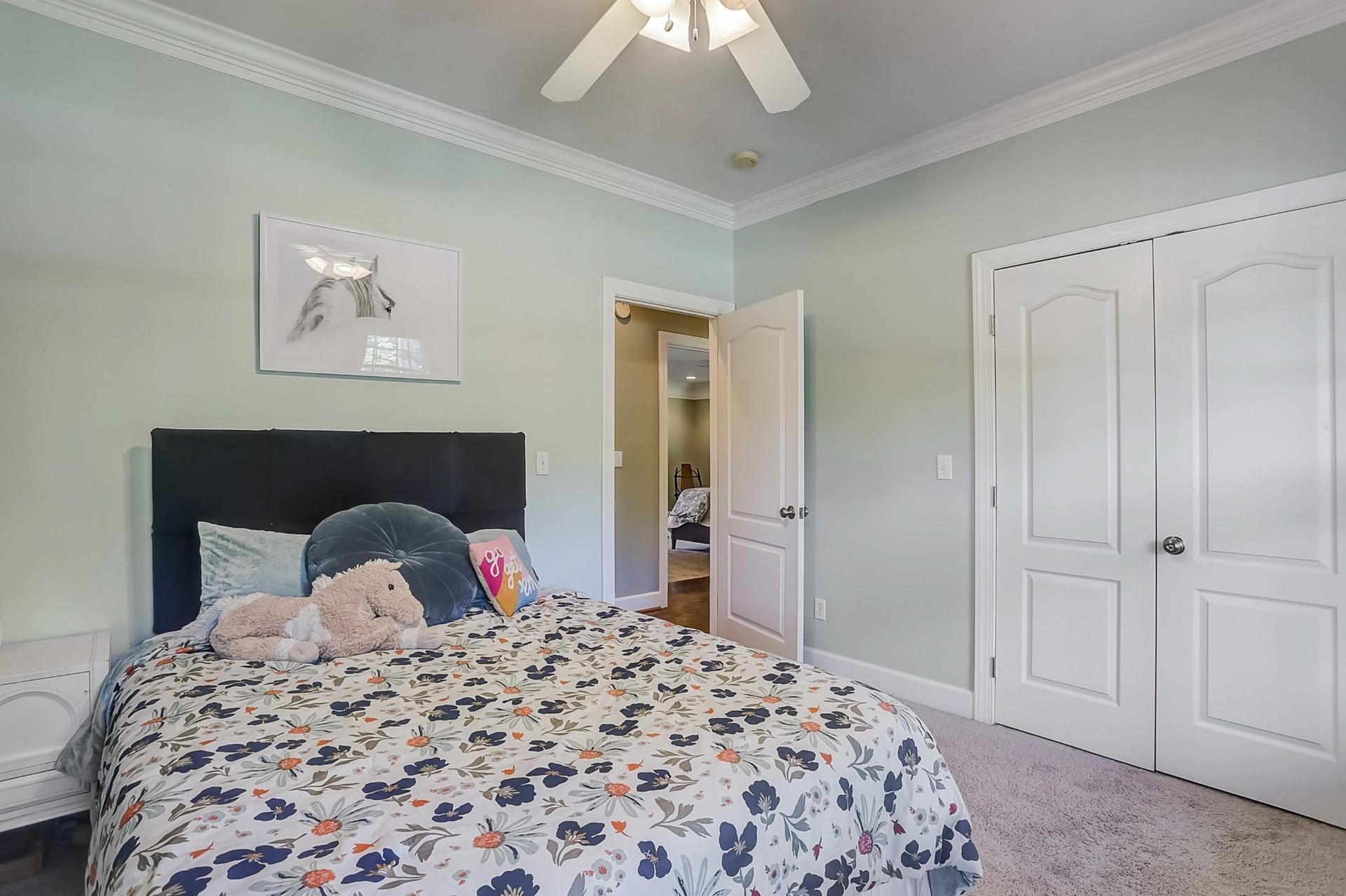 7532 King Road Fairview, TN 37062 - Photo 33 of 64 a bedroom with a bed and a chandelier